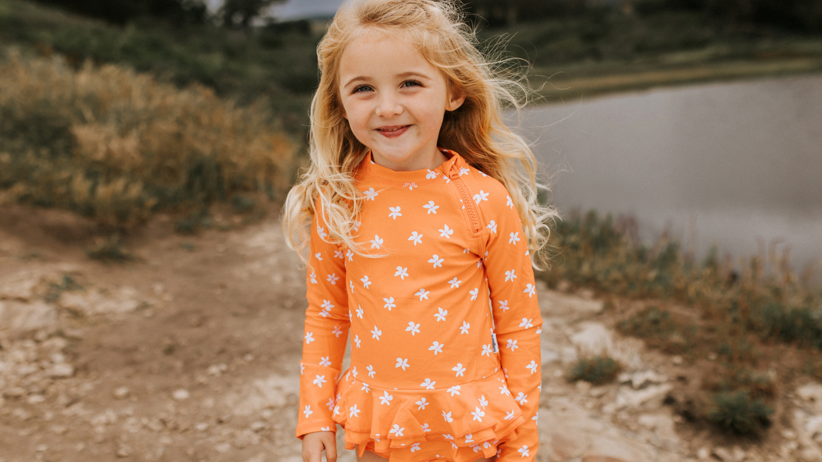 Why Bright Orange Swimwear Helps Kids Stand Out in the Water