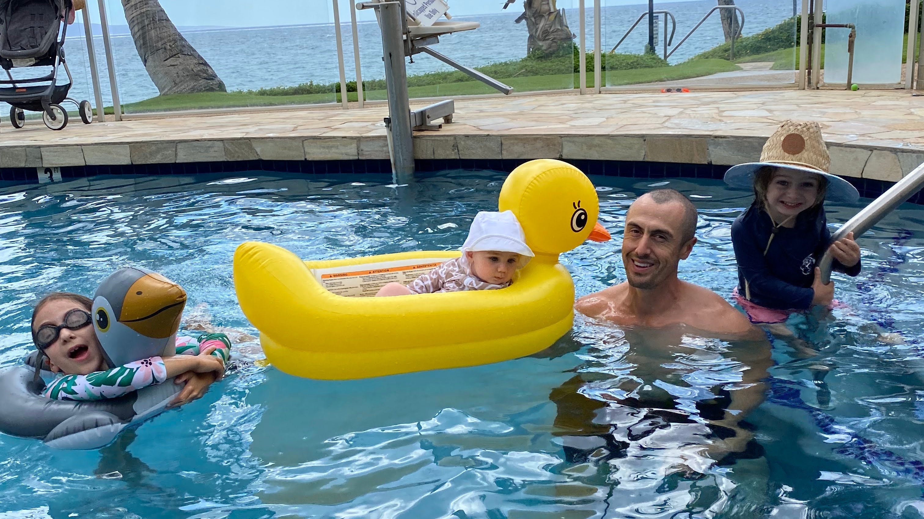 Family enjoying a tropical resort pool
