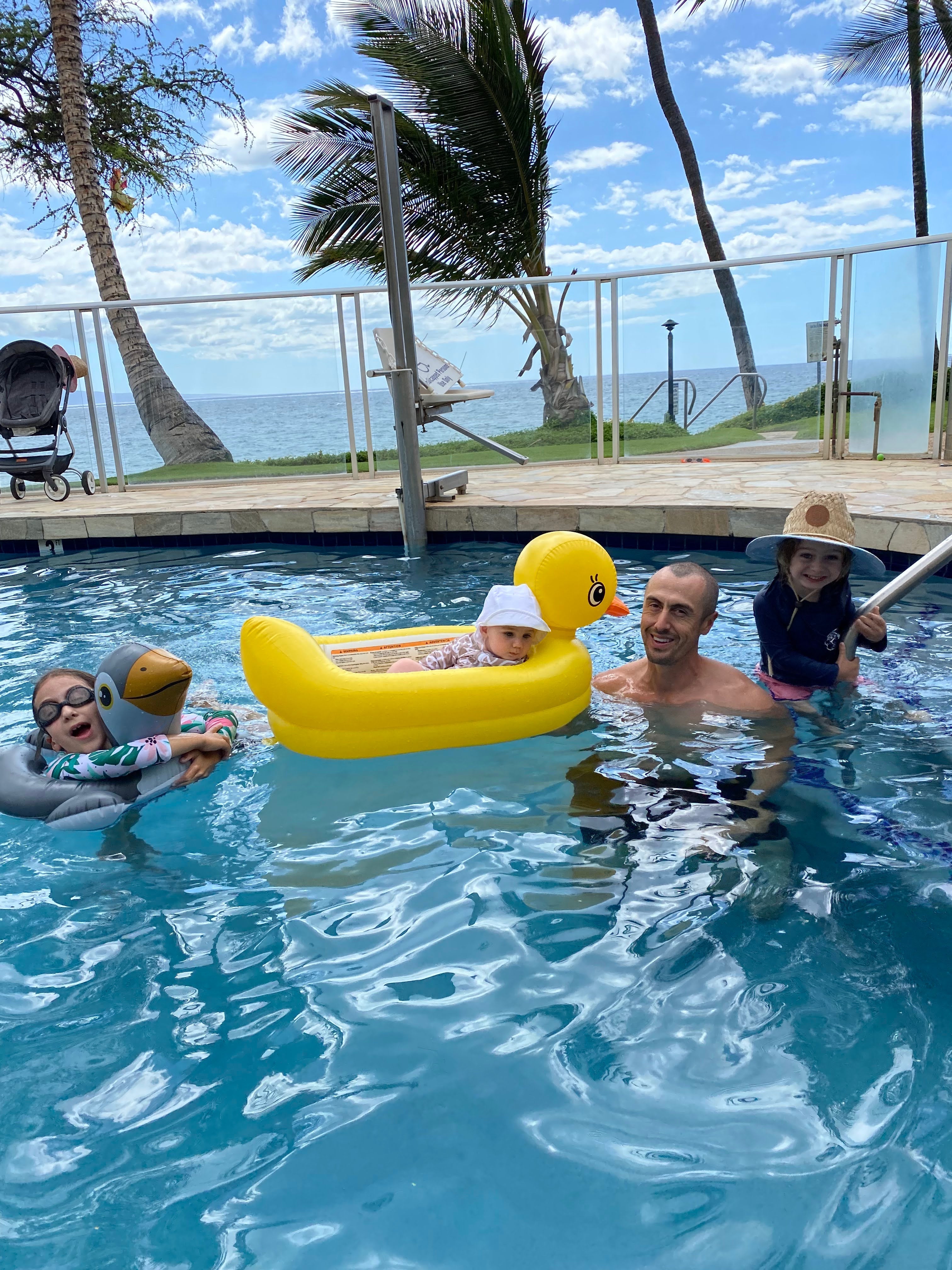 Family enjoying a tropical resort pool