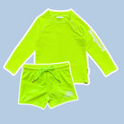 Neon green long-sleeve rash guard and shorts set on a light blue background